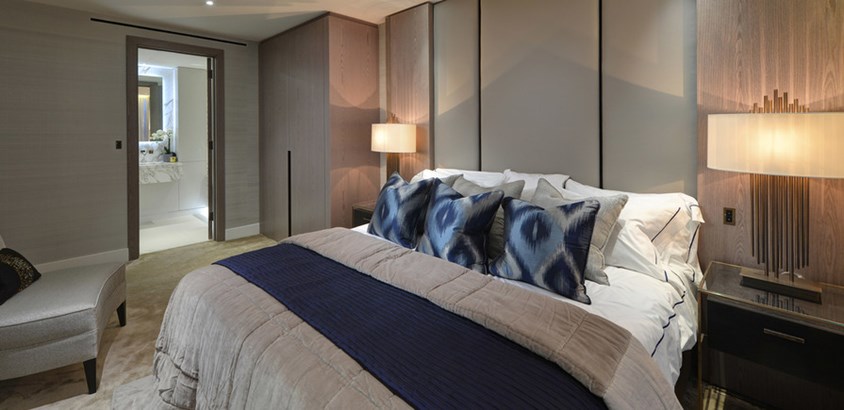 Bedroom leading to en suite through beautiful doorsets by Principal Doorsets